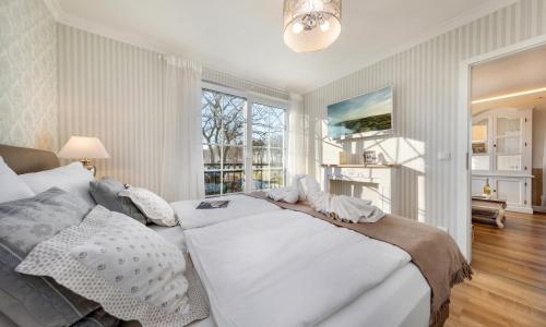 Llit o llits en una habitació de Villa Strandblick Zingst