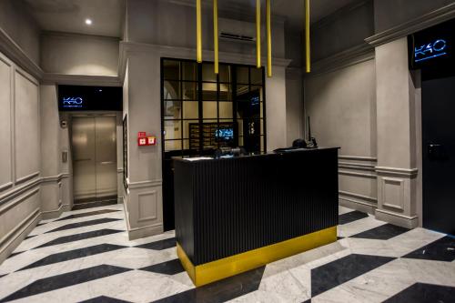 a lobby with a reception desk and a checkered floor at K40 Romantic Deluxe Studio In the City Center in Budapest