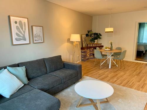 a living room with a couch and a table at Apartment Brauselay in Cochem