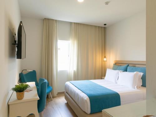 Krevet ili kreveti u jedinici u okviru objekta Santa Cruz Boutique Hotel