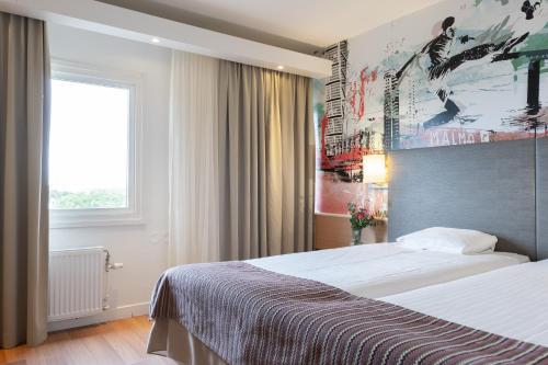 Tempat tidur dalam kamar di Good Morning+ Malmö