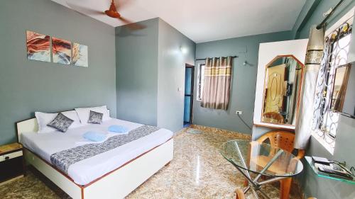 Кровать или кровати в номере Jackson's Beach House Calangute