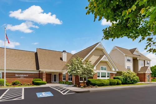 a house with an american flag in front of it at Residence Inn Hartford Rocky Hill in Rocky Hill