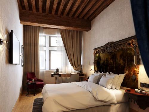 Cour des Loges Lyon, A Radisson Collection Hotel tesisinde bir odada yatak veya yataklar