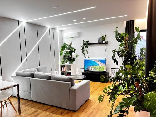 TV tai viihdekeskus majoituspaikassa Apartament Green Plant - 2 oddzielne sypialnie, taras 30m2 i garaż podziemny