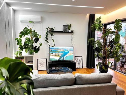 TV tai viihdekeskus majoituspaikassa Apartament Green Plant - 2 oddzielne sypialnie, taras 30m2 i garaż podziemny