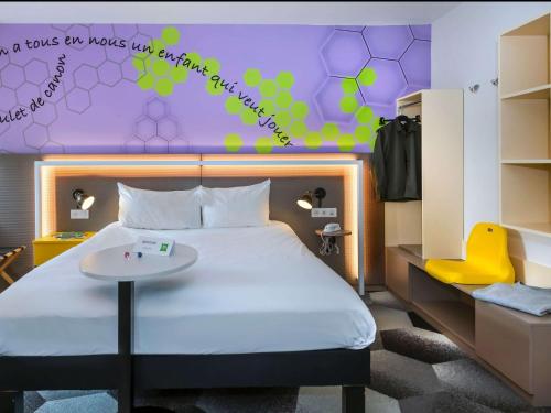 Vuode tai vuoteita majoituspaikassa ibis Styles Strasbourg Stade de la Meinau