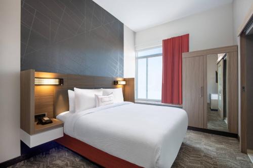 Gulta vai gultas numurā naktsmītnē SpringHill Suites Denver Parker