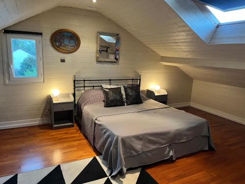 Cama ou camas em um quarto em Villa atmosphère à l'ile verte