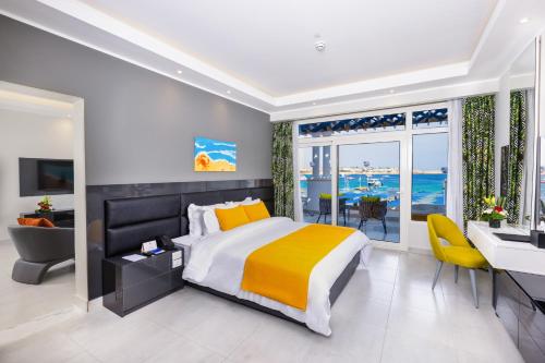 A bed or beds in a room at Naama Bay Suites & SPA