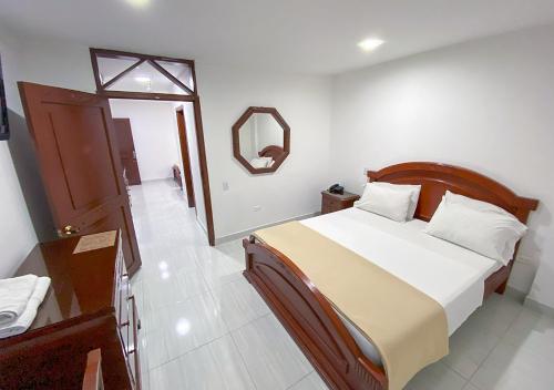 Tempat tidur dalam kamar di Hotel Exelsior