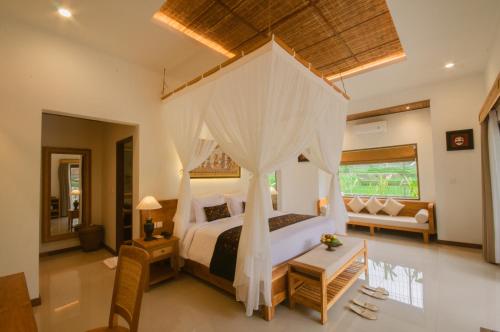 Govala Ubud Villas & SPA में एक कमरे में एक या कई बेड