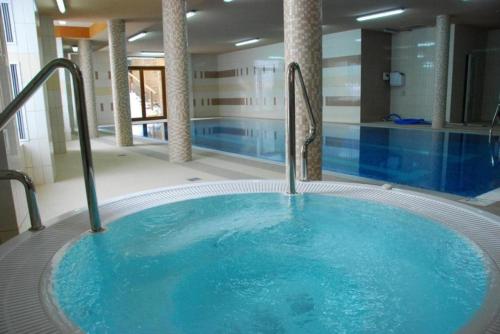 The swimming pool at or close to Mountain Apartments Szymoszkowa SPA Residence