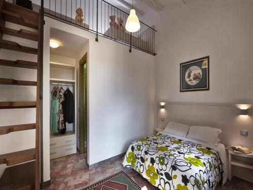 Tempat tidur dalam kamar di B&B ai Condotti di Pisa da Filippo