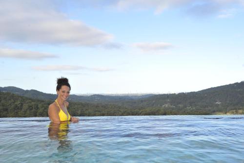 a woman standing in a body of water at On Eagle Wings Mountain Retreat & Spa in Neranwood