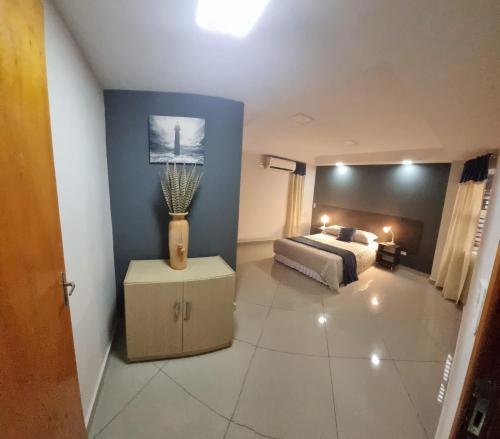 Una cama o camas en una habitación de Hermoso Departamento - Excelente Ubicación