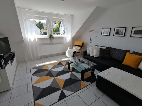 a living room with a couch and a table at Ferienwohnung Grete in Trier