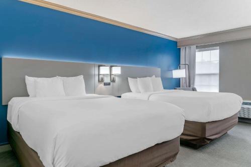 A bed or beds in a room at Comfort Inn