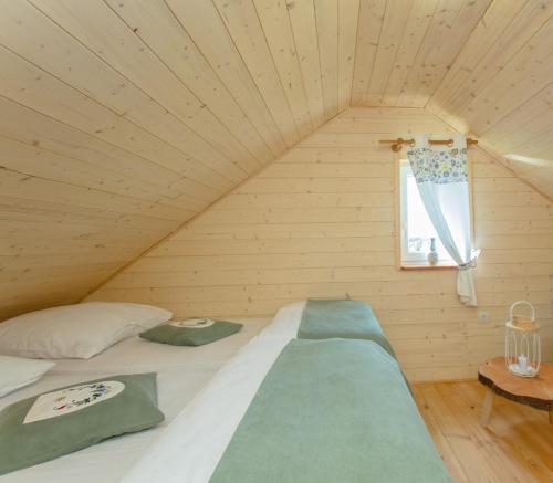 A bed or beds in a room at Kaszubskie Spa Ziółko