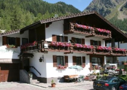 a large building with flowers on the top of it at Haus Bergkristall in Längenfeld