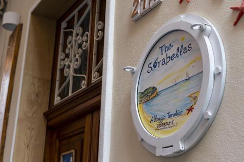 a toilet sign on the side of a building at The Sorabellas in Gaeta