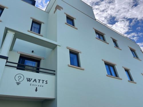 a view of the outside of a white building at Watts House in Seia