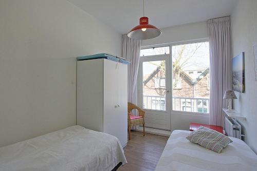 Una cama o camas en una habitación de Residence de L'Europe - Baddomburg