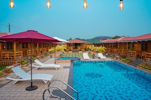 The swimming pool at or close to Grace Exotica Goa