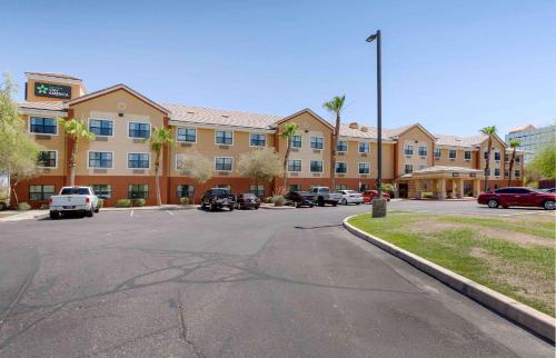 a parking lot in front of a large building at Extended Stay America Suites - Phoenix - Airport in Phoenix