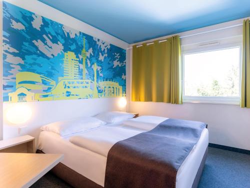 Krevet ili kreveti u jedinici u objektu B&B Hotel Stuttgart-City