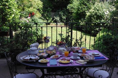 a black table with food and drinks on it at Teodora B&B in Milan