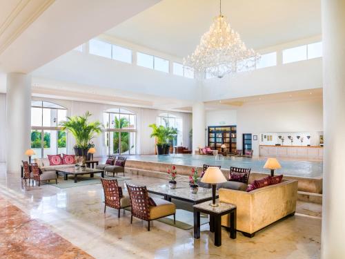 a large living room with a large ceiling at El Dorado Casitas Royale Catamarán, Cenote & More Inclusive in Puerto Morelos