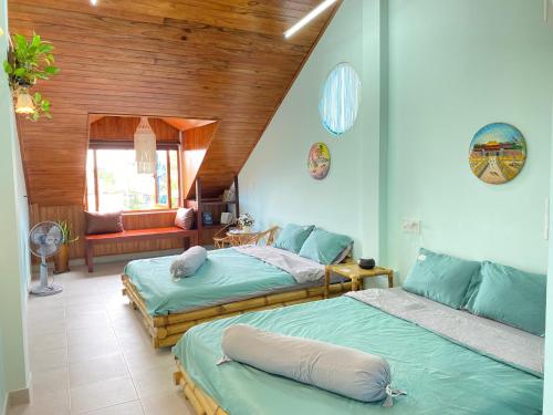 Ліжко або ліжка в номері Tâm Family Homestay-Huế