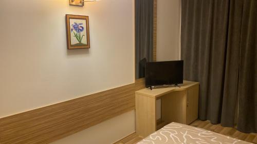 TV in/ali zabaviščno središče v nastanitvi Vitan ApartHotel