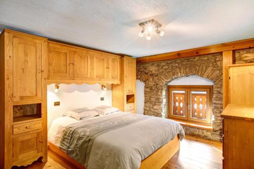 Una cama o camas en una habitación de Chalet vista Monte Bianco