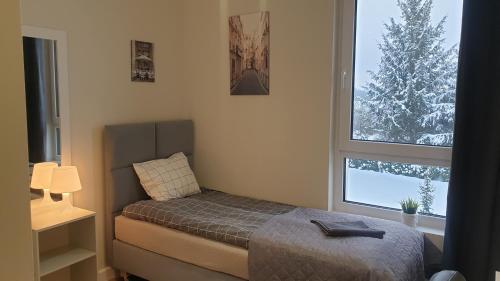 Кровать или кровати в номере White Room Wrocław przy Wyspie Opatowickiej