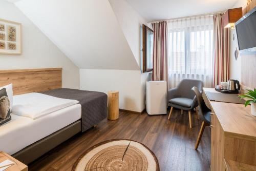 Svetainės erdvė apgyvendinimo įstaigoje Neo Hotel Linde Esslingen