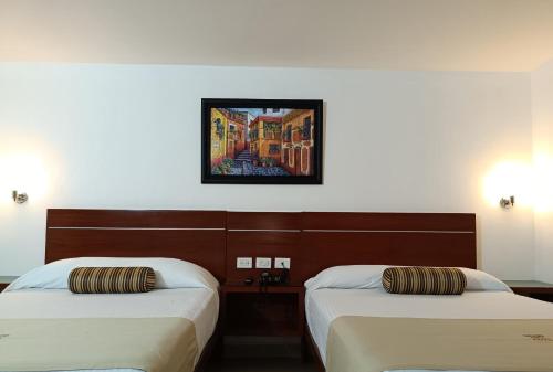 מיטה או מיטות בחדר ב-Grand City Hotel Cancun