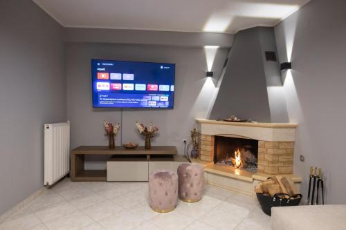 TV i/ili multimedijalni sistem u objektu George Living House