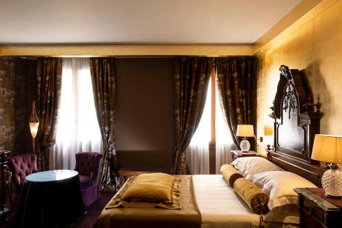 Cama ou camas em um quarto em Hotel Metropole Venezia