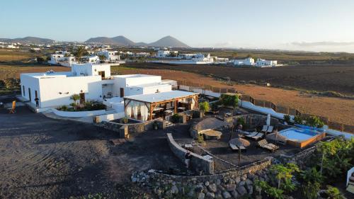 an aerial view of a house in a field at Finca Isolina Hotel Boutique - Adults Recommended in Mácher