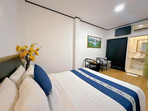 Posteľ alebo postele v izbe v ubytovaní New Star Inn Boutique Hotel-Near Bến Thành Market