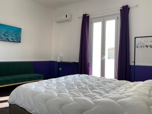 Rúm í herbergi á Myrtus Guest House Cagliari