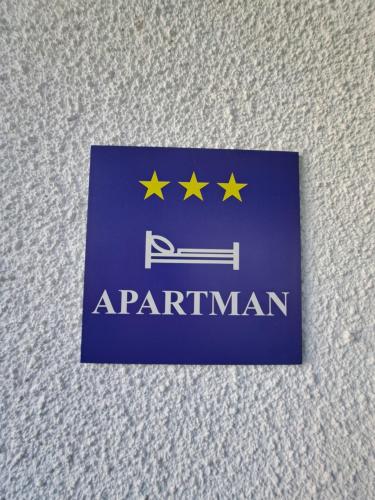 Um certificado, prêmio, placa ou outro documento exibido em Apartman Vitas