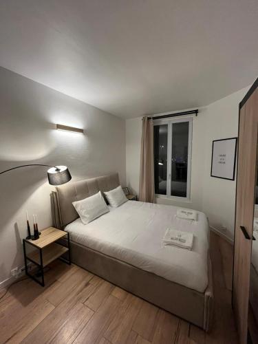 Una cama o camas en una habitación de Charmant appartement proche Paris et Stade de France !