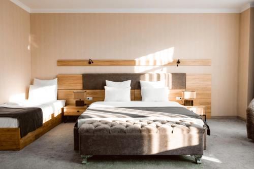 A bed or beds in a room at ART RESIDENCE Hotel