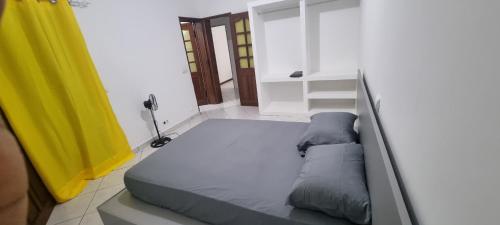 Una cama o camas en una habitación de Casa Cor de Rosa