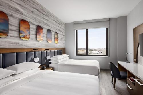 Krevet ili kreveti u jedinici u okviru objekta Marriott New York JFK Airport