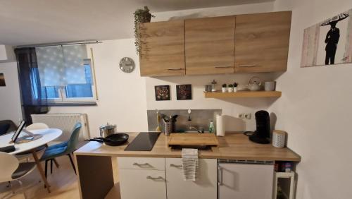 a kitchen with a wooden counter top in a room at Schöne Souterrain Wohnung (WLAN/Parken kostenlos) in Riegel