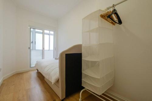 Tempat tidur dalam kamar di Apartamento T3 em Lisboa/ Queluz